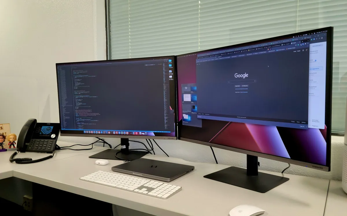 An office desk with two monitors